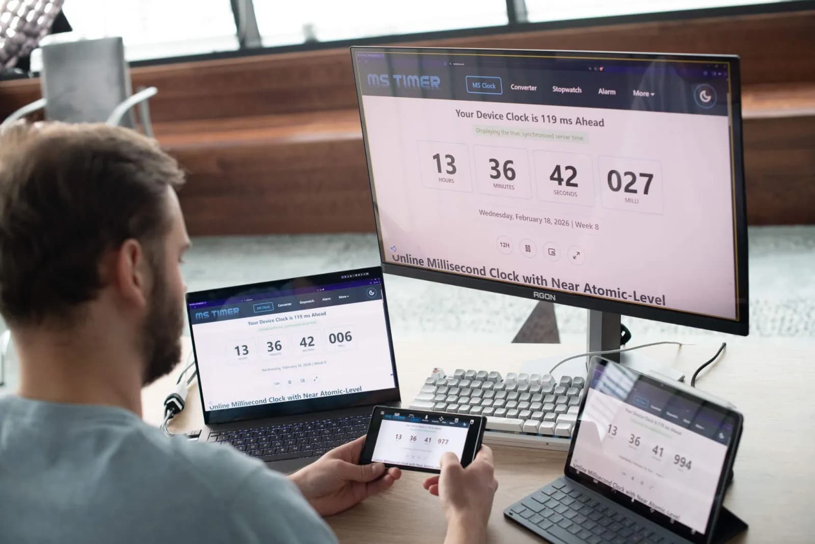 Latency test — the same clock on the remote PC, a laptop and a phone